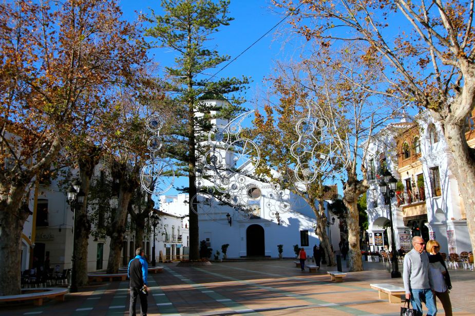 Courtyard at the Balcony of Europe with the Church of El Salvador in the background and Christmas decorations in the trees...can only imagine how beautiful it is at night